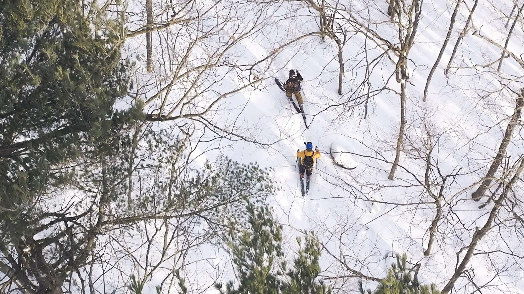 Two skiers on an alpine ski tour — Mont Rigaud, ski resort, snowboarding, alpine skiing, mountain biking, and hiking; family-friendly; in Rigaud, Quebec, near Montreal