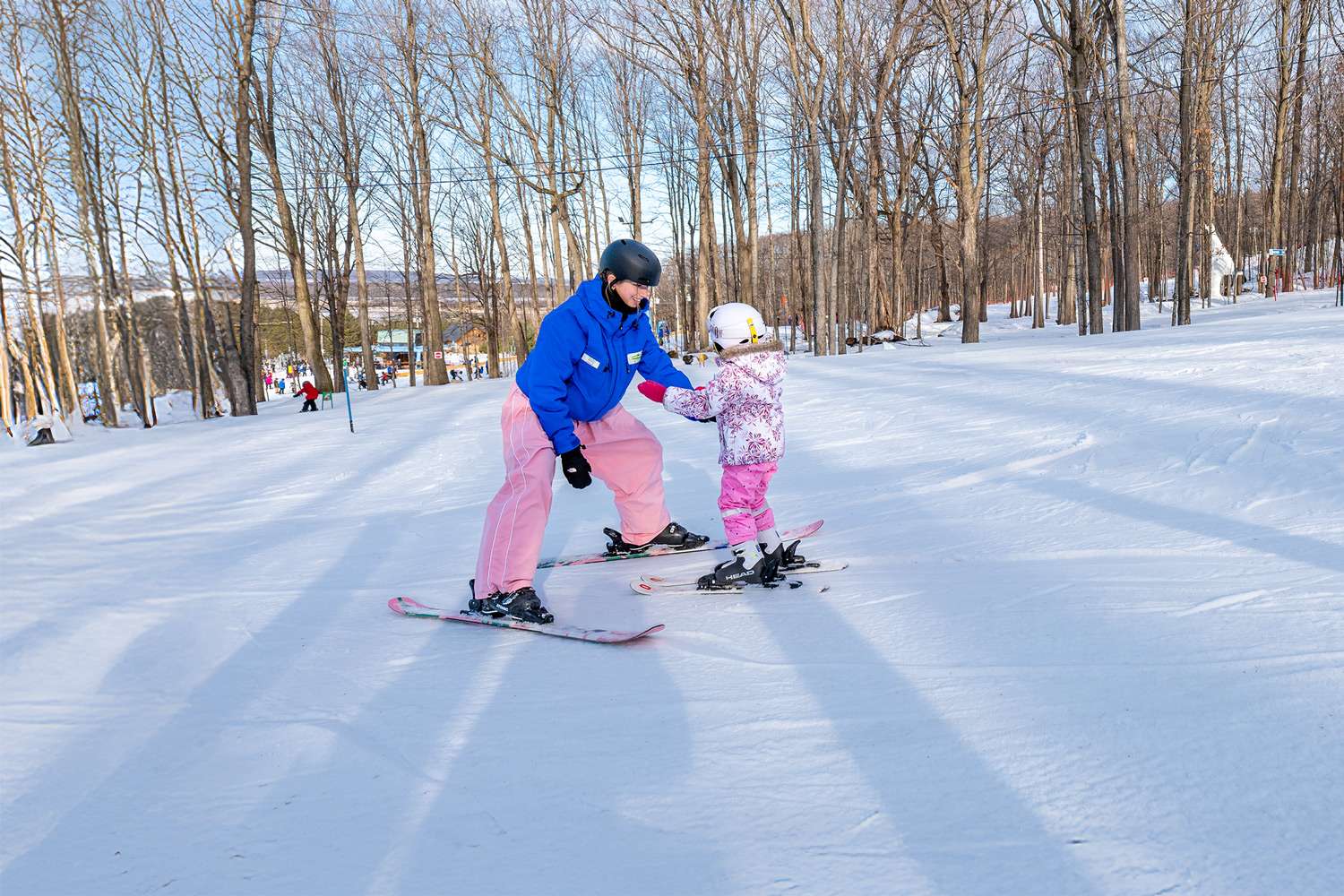 A ski instructor and her student — Mont Rigaud, ski resort, snowboarding, alpine touring, mountain biking, and hiking, family-friendly, in Rigaud, Quebec, near Montreal