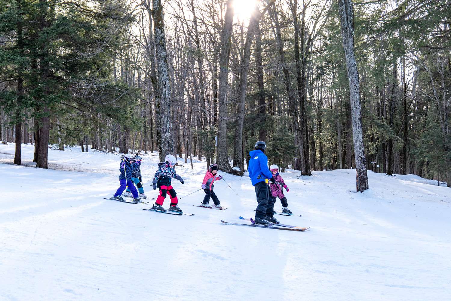 A ski instructor and his group — Mont Rigaud, ski resort, snowboarding, alpine touring, mountain biking, and hiking, family-friendly, in Rigaud, Quebec, near Montreal